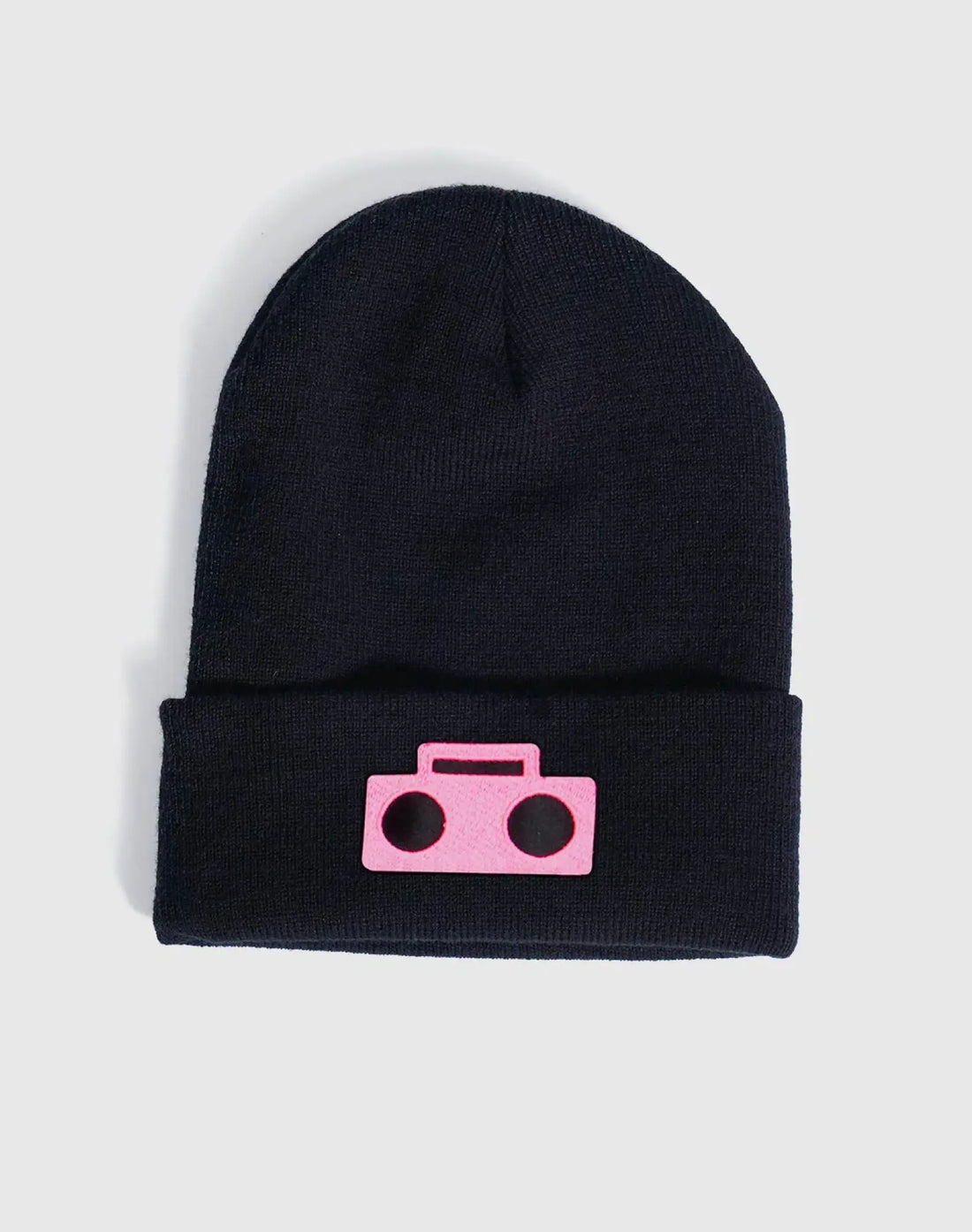 StereoType Kids Boombox Beanie flatlay in black acrylic knit with hot pink Boombox logo embroidered patch, unisex kids and adult gender-inclusive accessory designed in San Francisco
