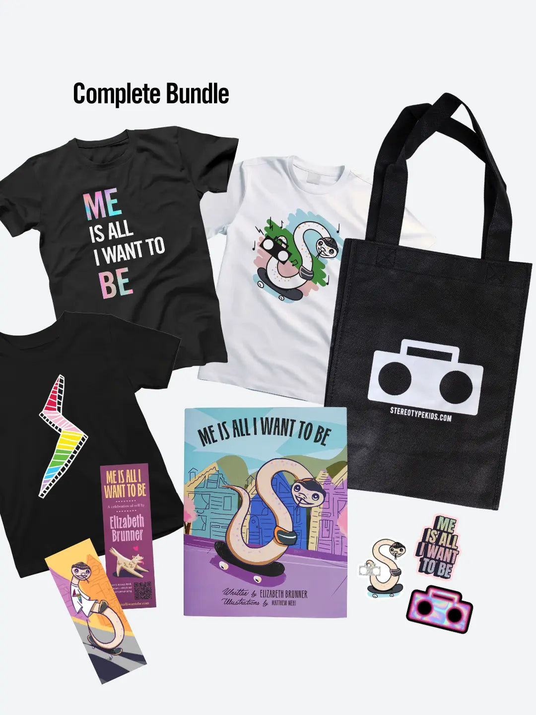 StereoType Kids Complete Bundle flatlay with black Me Is All I Want To Be Title Tee, white Stereo Snake Tee, black Lightning Bolt Tee, hardcover book, Boombox tote bag, bookmark and stickers