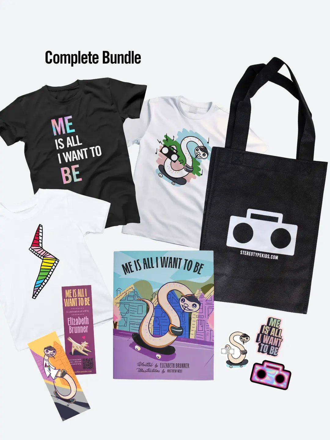 StereoType Kids Complete Bundle flatlay with black Me Is All I Want To Be Title Tee, white Stereo Snake Tee, white Lightning Bolt Tee, hardcover book, Boombox tote bag, bookmark and stickers