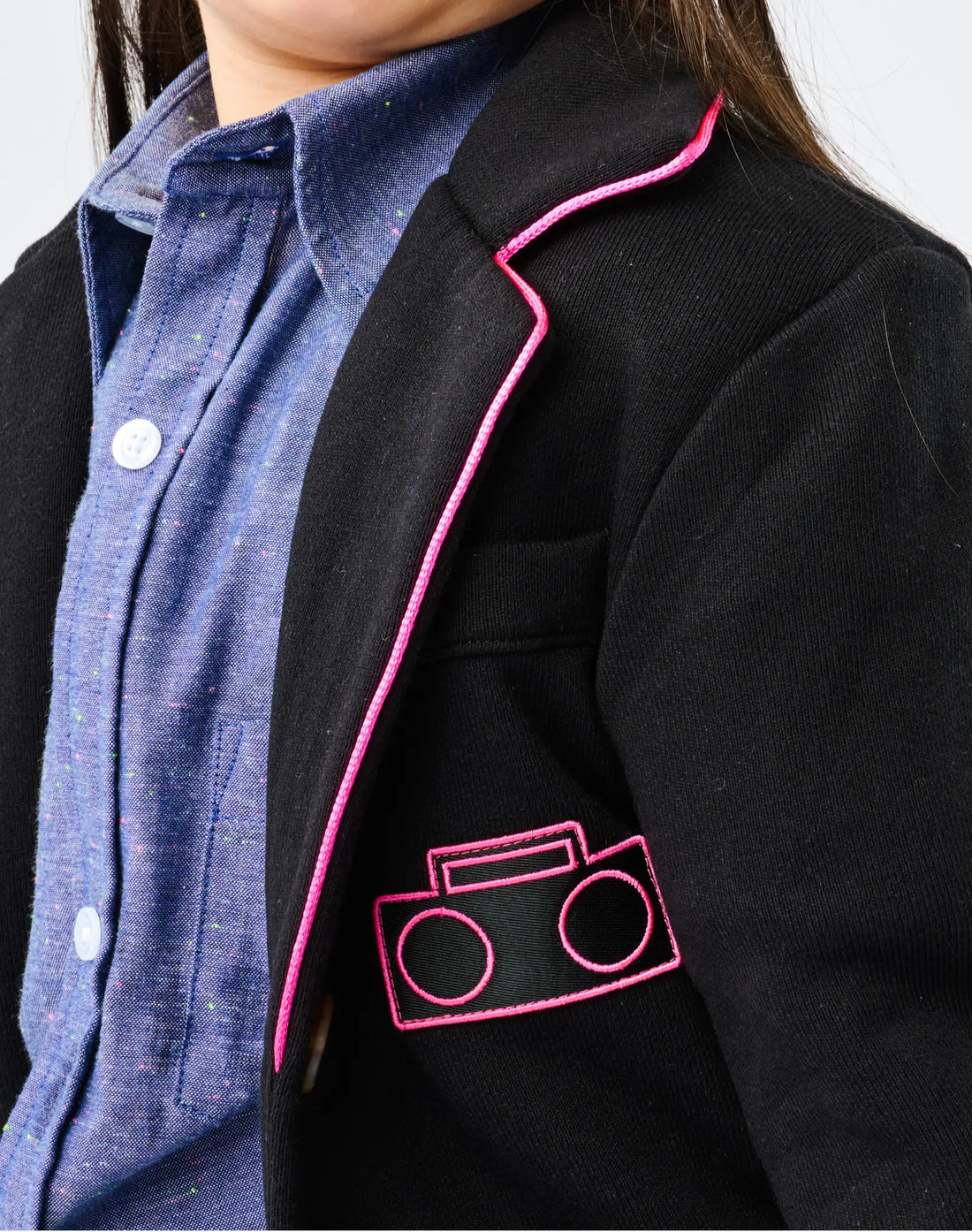 Close-up of StereoType Kids Hot Pink Boombox Blazer showing hot pink Boombox logo embroidered patch and pink trim on collar, embroidered in San Francisco