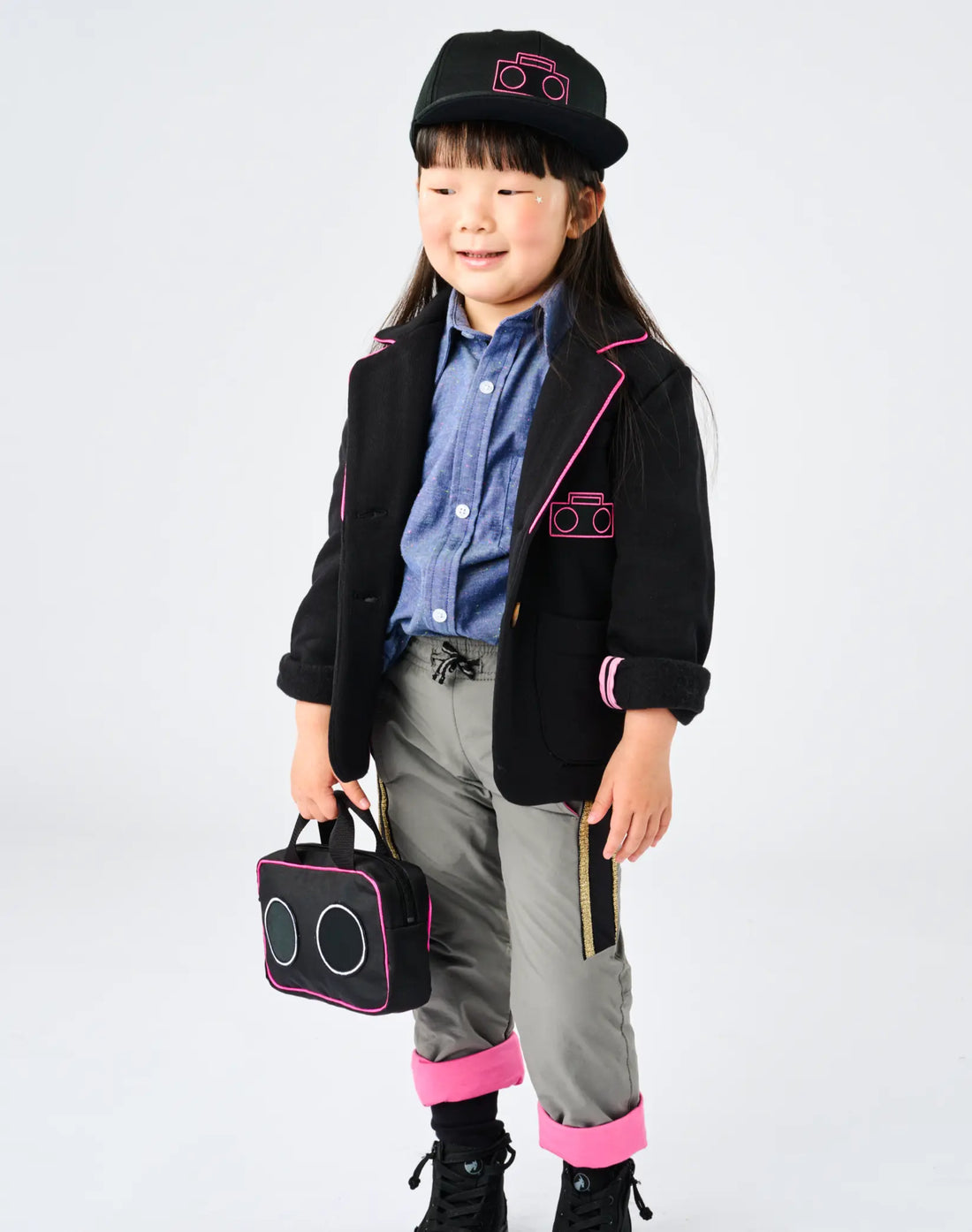 Child wearing StereoType Kids Hot Pink Boombox Blazer with Boombox Baseball Cap, Chambray Button-Down Zip Shirt, Active Pant and Boombox Treasure Bag, unisex kids gender-inclusive fashion