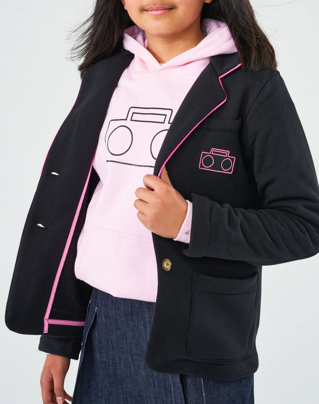 StereoType Kids Hot Pink Boombox Blazer open showing pink ribbon finished interior seams and hot pink Boombox embroidered patch, layered over pink Boombox Logo Hoodie