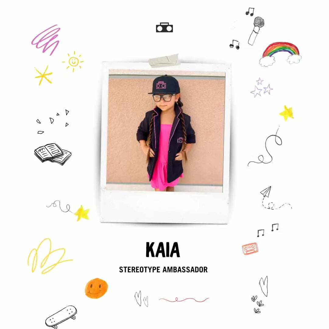 Portrait of StereoType Kids brand ambassador Kaia wearing the Hot Pink Boombox Blazer, STK hat, and pink dress, celebrating creativity, confidence, and freedom of self-expression.