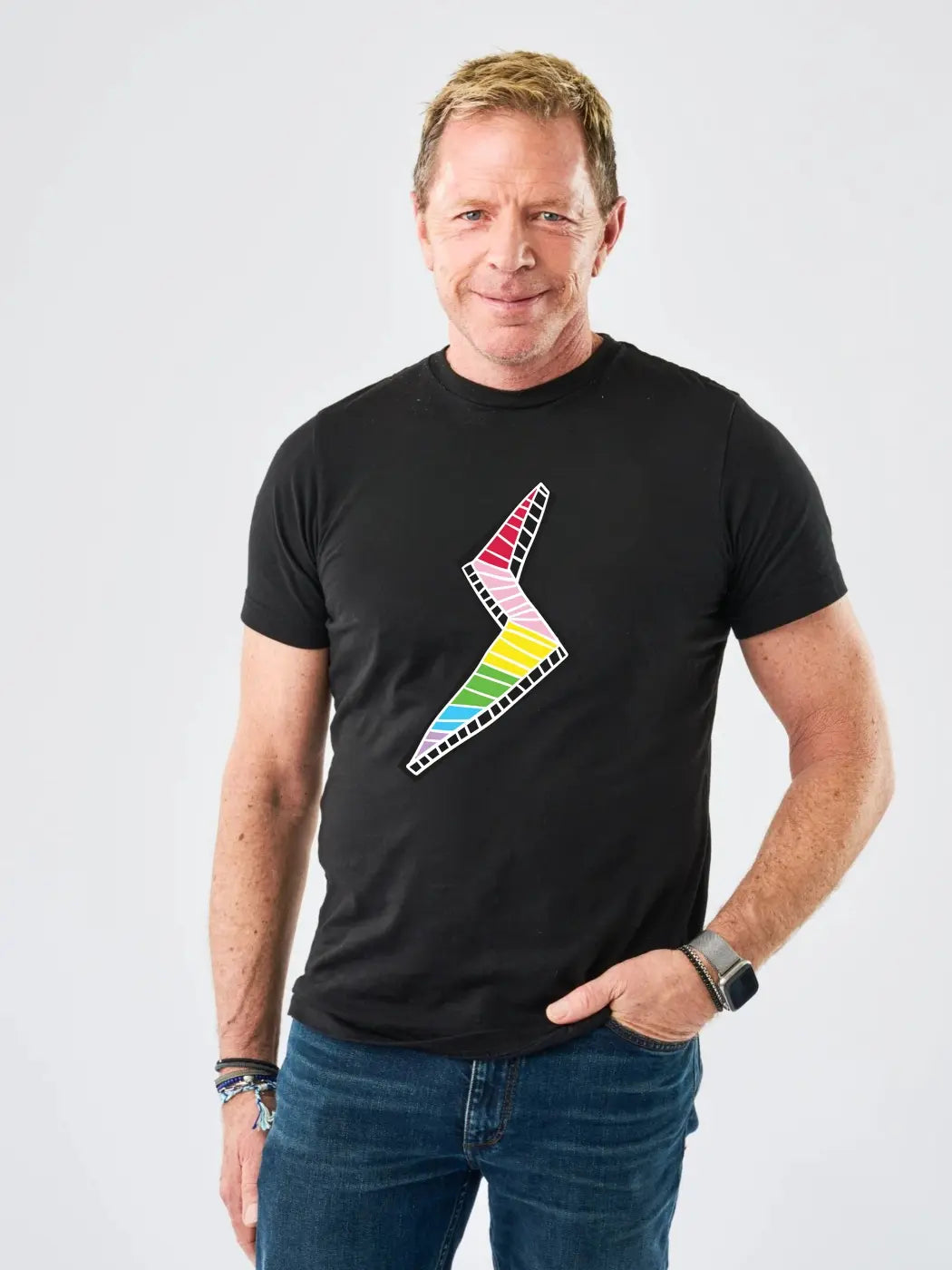 Adult wearing StereoType Kids Lightning Bolt unisex adult black graphic tee featuring rainbow lightning bolt designed by co-founder Chloe, gender-inclusive blended fashion