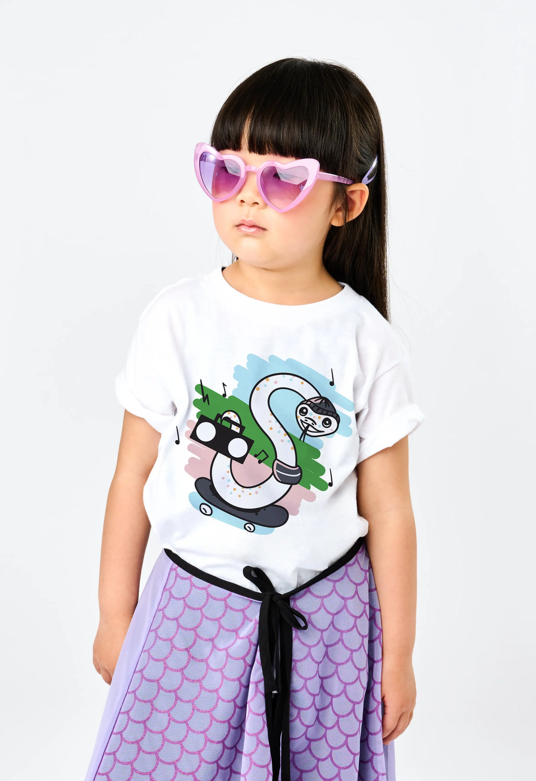 Child wearing StereoType Kids Stereo the Snake white graphic t-shirt, gender-inclusive youth fashion