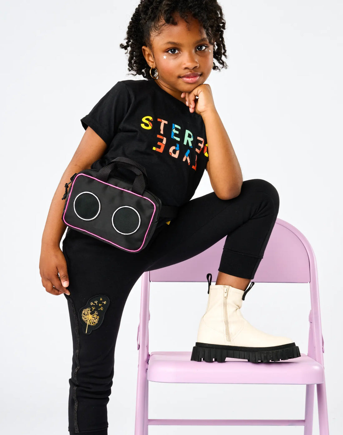 Child wearing StereoType Kids black Kaleidoscope Logo tee with Boombox Treasure Bag and Boombox Knit Sweats Pants
