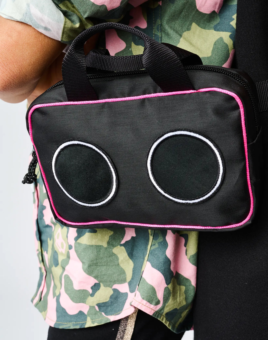 Stereotype Kids Boombox Treasure Bag closeup showing embroidered speaker circles and hot pink zipper