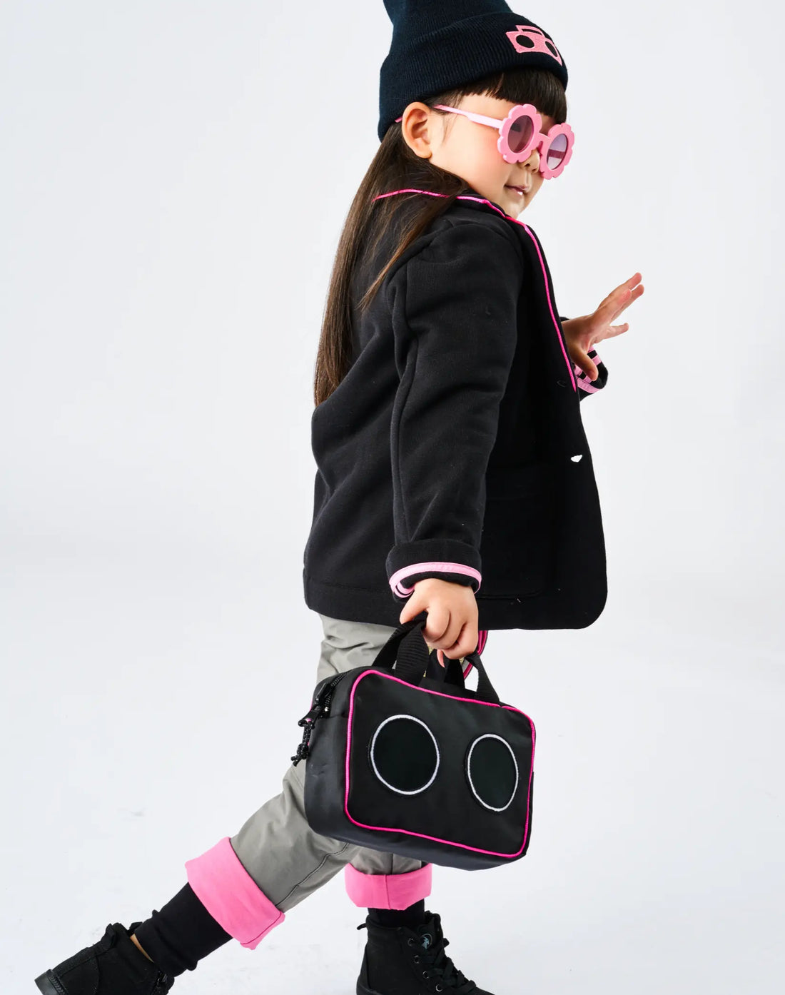 Stereotype Kids Boombox Treasure Bag worn by child with flower sunglasses and navy beanie, carried at sid
