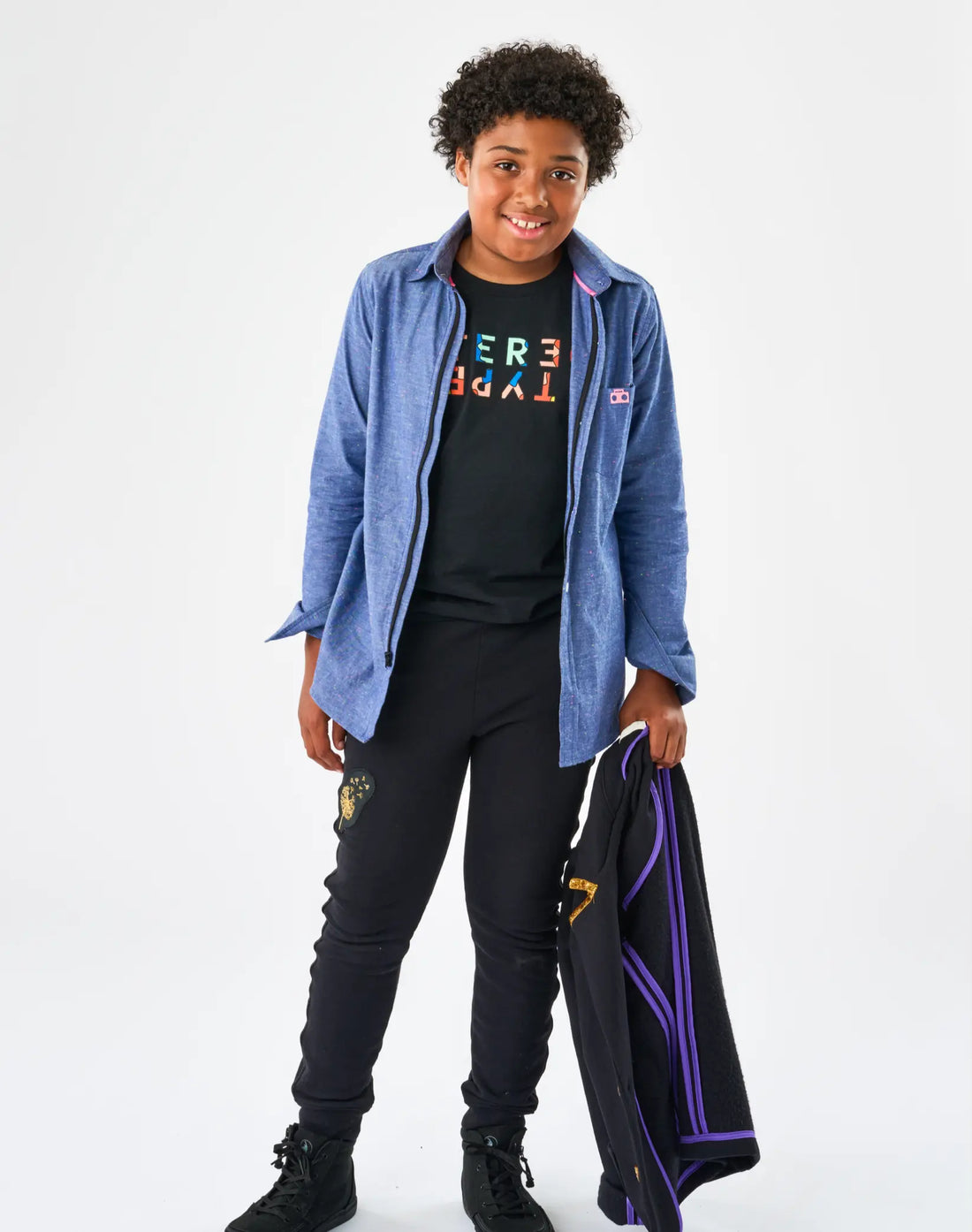 tereotype Kids Chambray Button-down Zip Shirt in blue rainbow speckle worn open over Stereotype tee with Boombox knit sweats