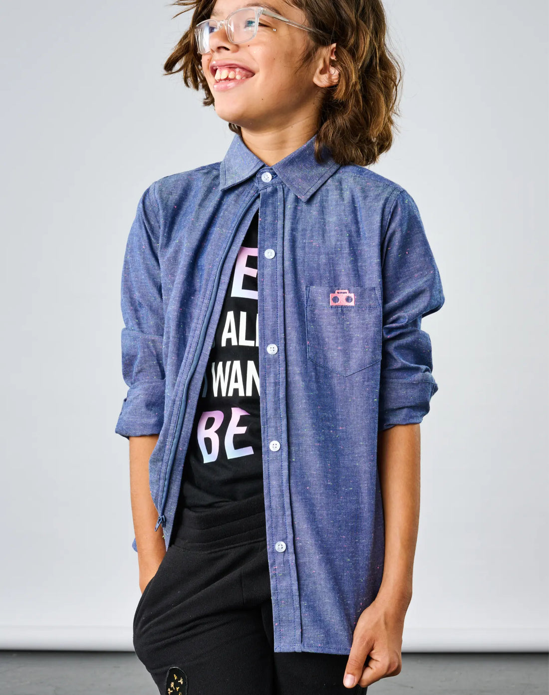 Stereotype Kids Chambray Button-down Zip Shirt worn open over Me Is All I Want To Be tee by smiling child with glasses