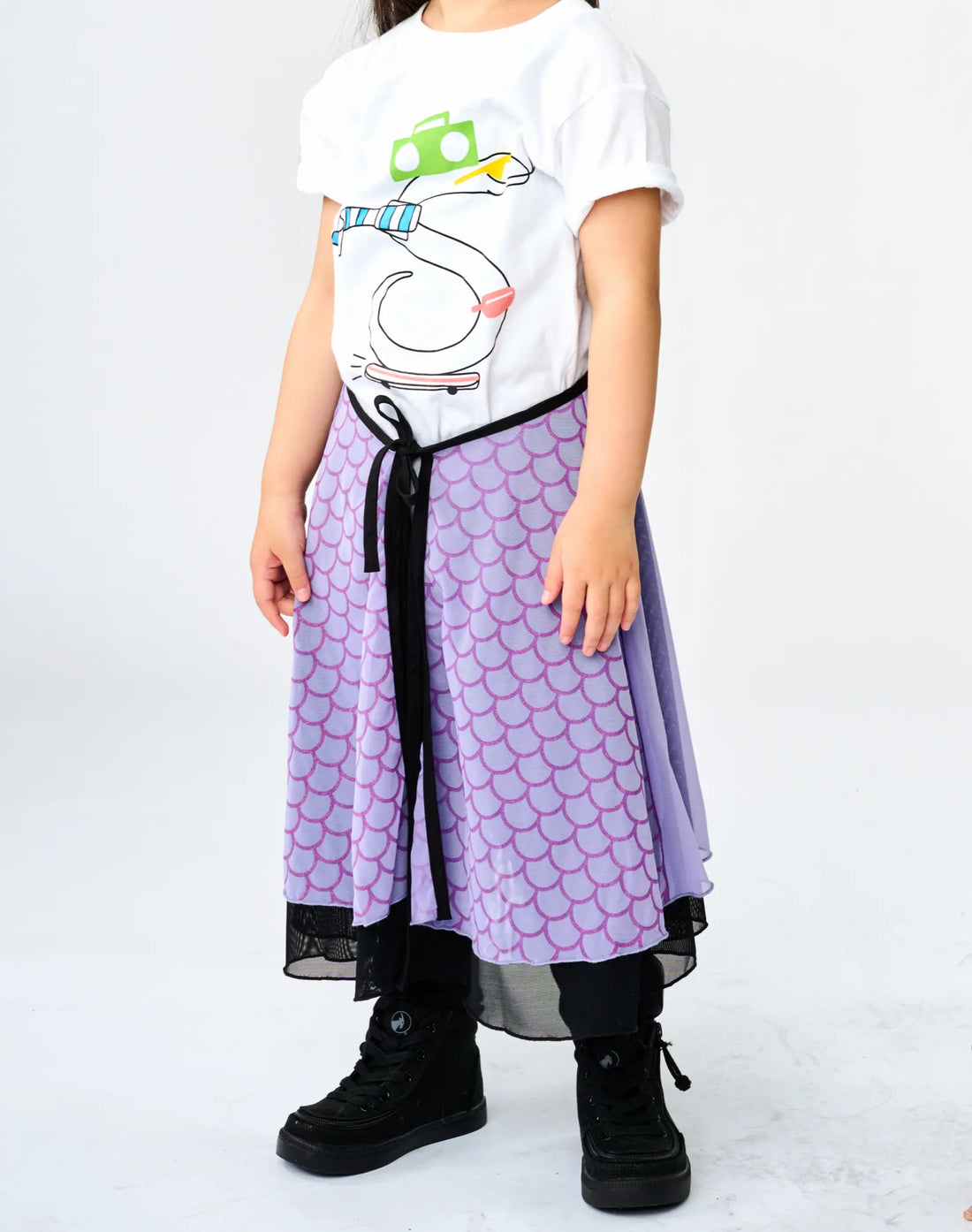 Stereotype Kids Hero Skirt in purple scale print with mesh overlay and black ribbon tie, styled with black combat boots