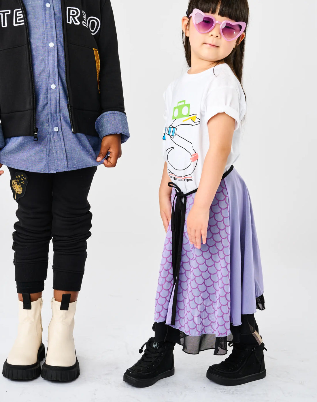 Stereotype Kids Hero Skirt in purple scale print styled with heart sunglasses and black combat boots